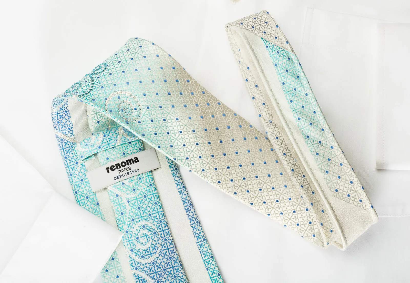 Renoma Necktie Blue Cartouche Rhinestone Scrolls On White Silk With Silver Sparkles